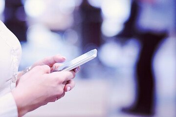 Image showing Elegant Woman Using Mobile Phone in startup office building