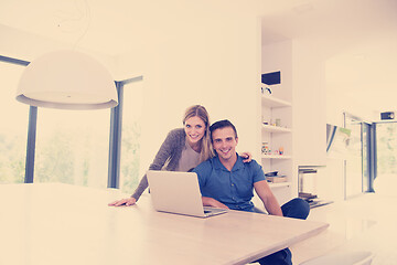 Image showing couple using laptop at home