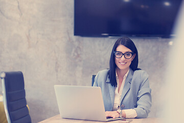 Image showing businesswoman using a laptop in startup office