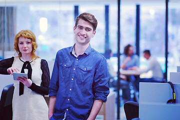 Image showing Business People Working With Tablet in startup office