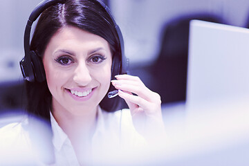 Image showing female call centre operator doing her job