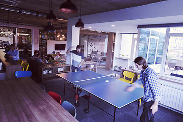 Image showing playing ping pong tennis at creative office space