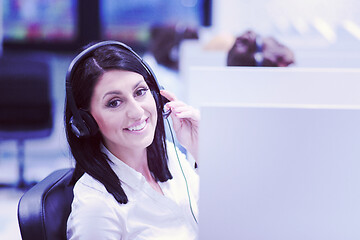 Image showing female call centre operator doing her job