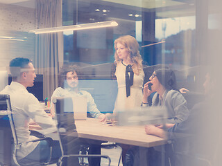 Image showing Startup Business Team At A Meeting at modern night office buildi