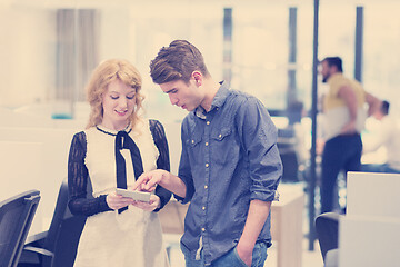 Image showing Business People Working With Tablet in startup office