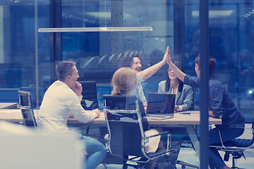 Image showing startup Group of young business people celebrating success