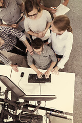 Image showing startup business people group working as team to find solution