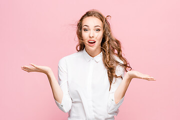 Image showing Surprised happy beautiful woman looking in excitement.