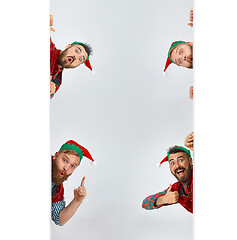 Image showing friendly men dressed like a funny gnome posing on an isolated gray background