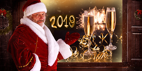 Image showing The man in costume of santa claus over night city background