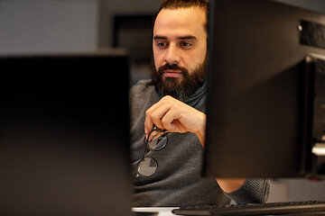 Image showing close up of creative man working at night office