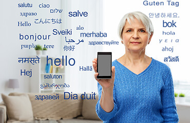 Image showing senior woman using translator on smartphone