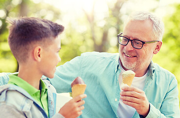 Image showing old man and boy eating ice cream at summer park