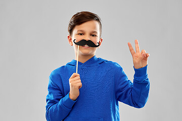 Image showing smiling boy in blue hoodie with black moustaches