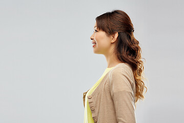 Image showing happy asian woman over grey background