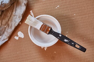 Image showing Paint brush on a can of white wall paint