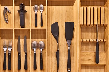 Image showing Minimalist kitchen tools put away in a drawer