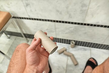 Image showing Finding empty roll in the restroom