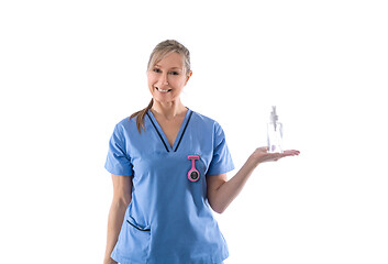 Image showing Nurse holding hand sanitizer or other product in palm of hand