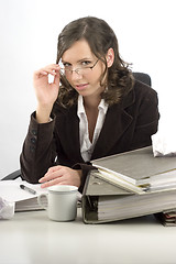 Image showing Young businesswoman at desktop