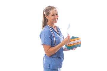 Image showing Doctor or nurse holding a box of medical face masks