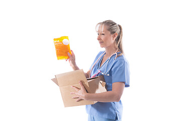 Image showing A nurse holds a box of N95 respirator masks