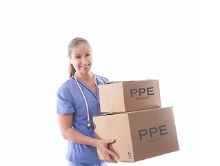 Image showing Nurse or healthcare worker holding boxes of PPE or medical equip