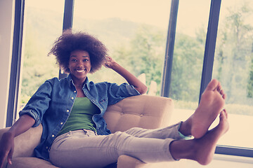 Image showing black women at home in the chair