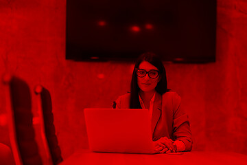 Image showing businesswoman using a laptop in startup office