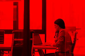 Image showing businesswoman using a laptop in startup office