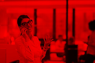 Image showing Elegant Woman Using Mobile Phone in startup office building