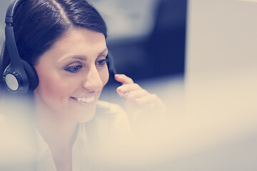 Image showing female call centre operator doing her job