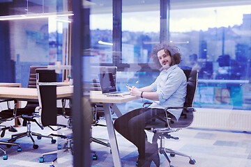 Image showing Young casual businessman using smartphone