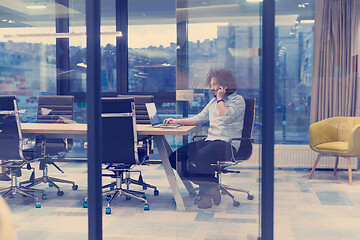 Image showing Young casual businessman using smartphone