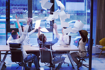 Image showing startup Group of young business people throwing documents