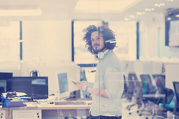 Image showing businessman using tablet computer