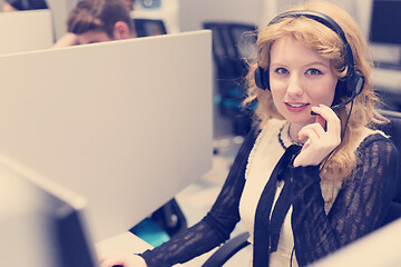 Image showing female call centre operator doing her job