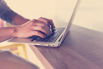 Image showing close up of male hands while working in modern office