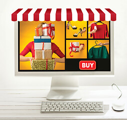 Image showing Internet online shopping concept with computer and cart