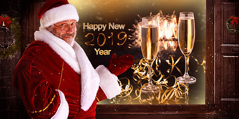 Image showing The man in costume of santa claus over night city background