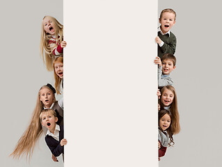 Image showing Banner with a surprised children peeking at the edge