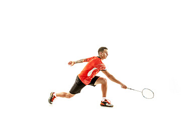 Image showing Young male badminton player over white background