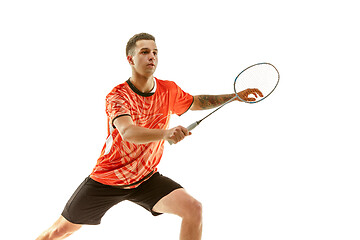 Image showing Young male badminton player over white background