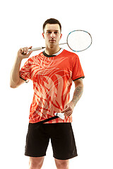 Image showing Young male badminton player over white background