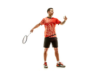 Image showing Young male badminton player over white background