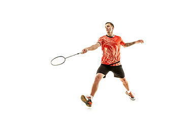 Image showing Young male badminton player over white background