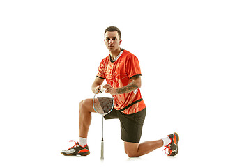 Image showing Young male badminton player over white background