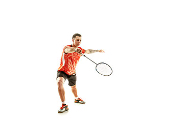 Image showing Young male badminton player over white background