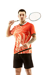 Image showing Young male badminton player over white background