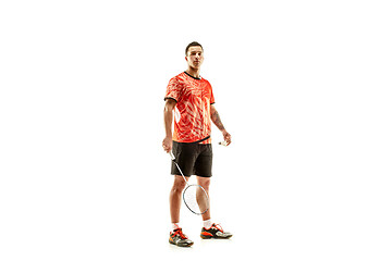 Image showing Young male badminton player over white background